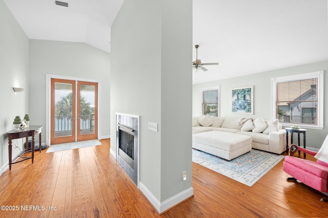 231 Barrataria Dr, Saint Augustine, FL 32080 - living room featuring hardwood / wood-style floors, high vaulted ceiling, a fireplace, and baseboards