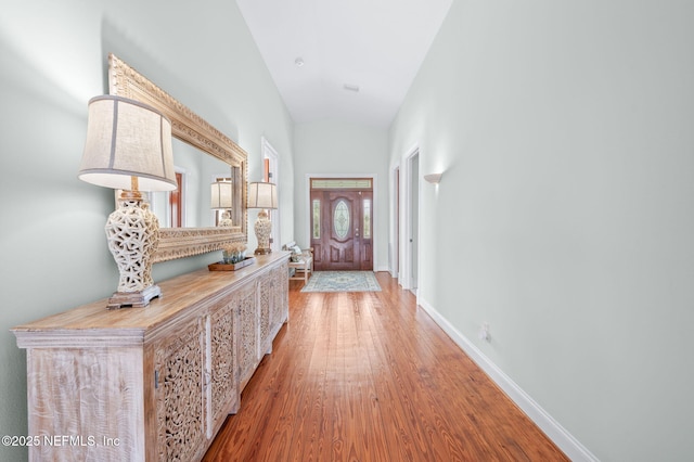 231 Barrataria Dr, Saint Augustine, FL 32080 - entryway with wood finished floors, vaulted ceiling, and baseboards