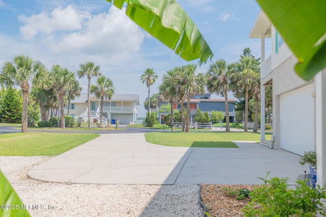 231 Barrataria Dr, Saint Augustine, FL 32080 - view of community featuring a yard, a residential view, and a garage