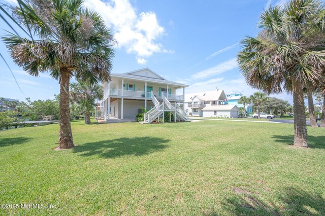 231 Barrataria Dr, Saint Augustine, FL 32080 - view of front of house featuring stairway, a porch, and a front lawn