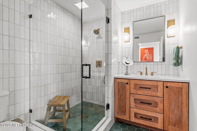 901 Ocean Blvd Unit 91, Atlantic Beach, FL 32233 - full bathroom with tile walls, vanity, a stall shower, toilet, and tile patterned floors