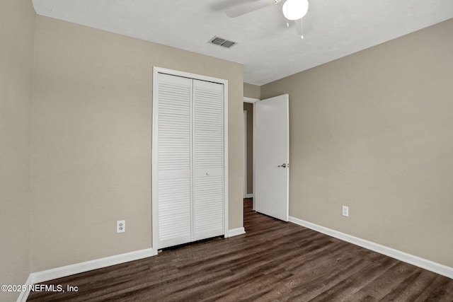 2650 Cardigan Ct, Orange Park, FL 32065 - unfurnished bedroom with a closet, dark wood-type flooring, baseboards, and ceiling fan