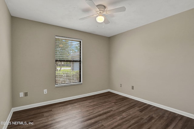 2650 Cardigan Ct, Orange Park, FL 32065 - spare room with dark wood-type flooring, baseboards, and a ceiling fan
