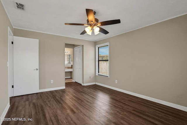 2650 Cardigan Ct, Orange Park, FL 32065 - unfurnished bedroom featuring wood finished floors, baseboards, crown molding, ensuite bath, and ceiling fan