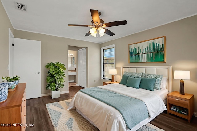 2650 Cardigan Ct, Orange Park, FL 32065 - bedroom with wood finished floors, baseboards, ornamental molding, connected bathroom, and ceiling fan