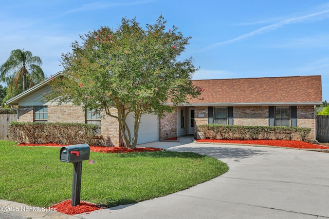 2650 Cardigan Ct, Orange Park, FL 32065 - ranch-style home featuring brick siding, concrete driveway, and a garage