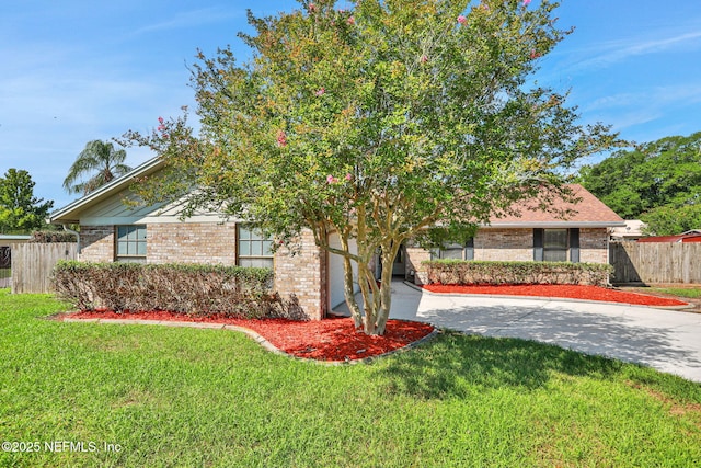 2650 Cardigan Ct, Orange Park, FL 32065 - view of property hidden behind natural elements with brick siding and concrete driveway