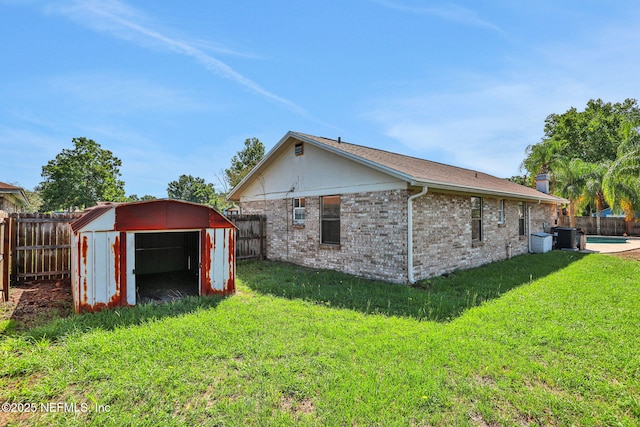 2650 Cardigan Ct, Orange Park, FL 32065 - view of side of property featuring a detached garage, central air condition unit, and brick siding