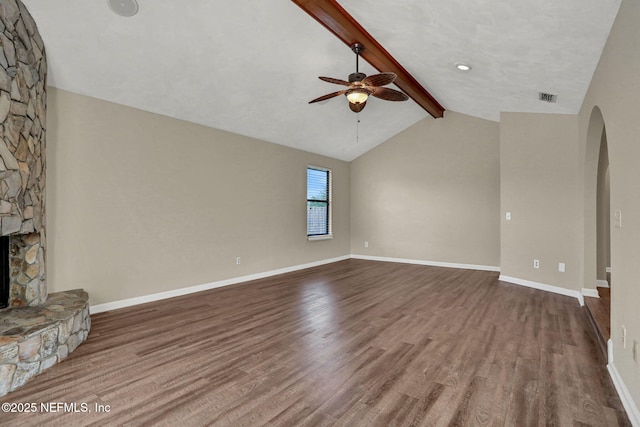 2650 Cardigan Ct, Orange Park, FL 32065 - unfurnished living room with ceiling fan, arched walkways, a fireplace, and wood finished floors