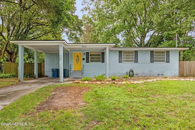7456 Burlingame Dr S, Jacksonville, FL 32211 - view of front of home with driveway, crawl space, an attached carport, and entry steps