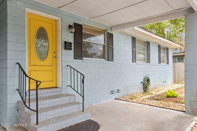 7456 Burlingame Dr S, Jacksonville, FL 32211 - entrance to property featuring concrete block siding