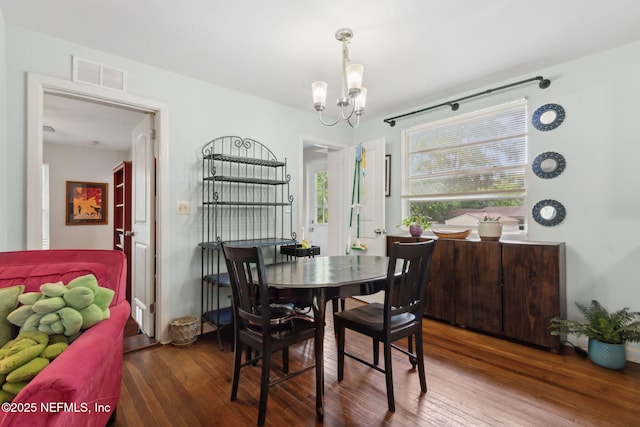 7456 Burlingame Dr S, Jacksonville, FL 32211 - dining space featuring a chandelier and wood finished floors