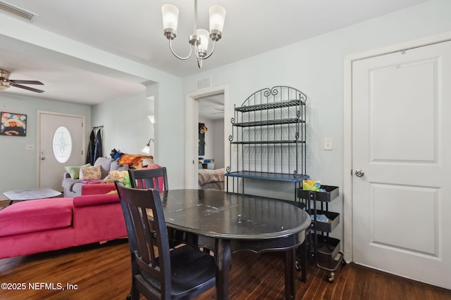 7456 Burlingame Dr S, Jacksonville, FL 32211 - dining room featuring wood finished floors, a chandelier, and a ceiling fan