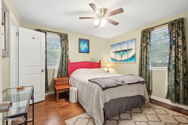 7456 Burlingame Dr S, Jacksonville, FL 32211 - bedroom featuring wood finished floors, multiple windows, and baseboards