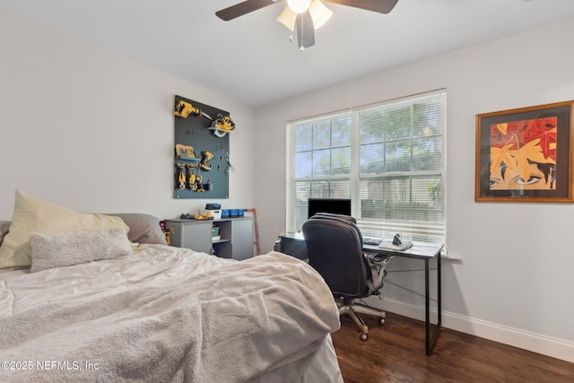7456 Burlingame Dr S, Jacksonville, FL 32211 - bedroom with baseboards, wood finished floors, a desk, and a ceiling fan