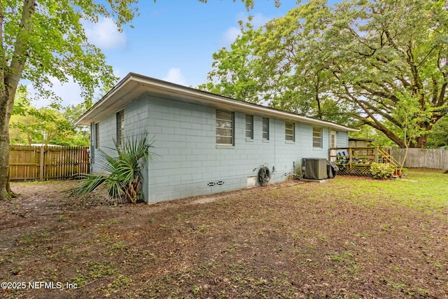 7456 Burlingame Dr S, Jacksonville, FL 32211 - back of house with a fenced backyard, a deck, central AC unit, and crawl space