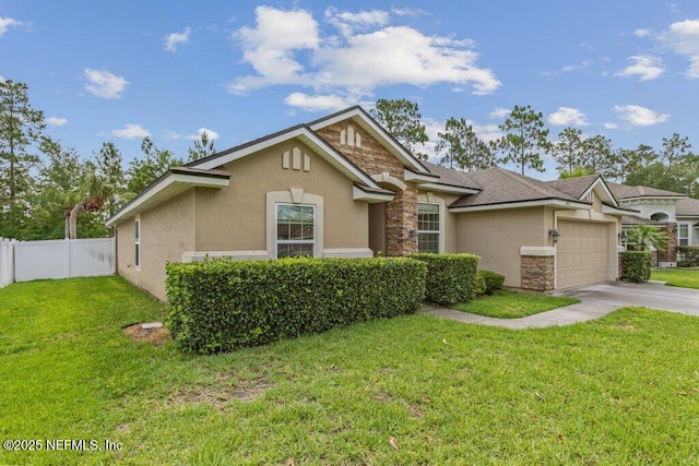 3912 Pipit Pt, Middleburg, FL 32068 - view of front of property featuring stucco siding, stone siding, a garage, and concrete driveway