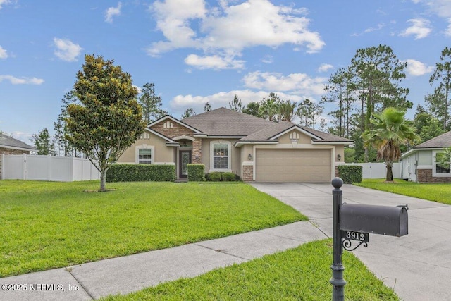 3912 Pipit Pt, Middleburg, FL 32068 - view of front facade with stucco siding, a garage, concrete driveway, and stone siding