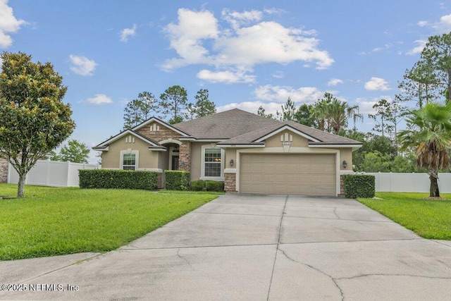 3912 Pipit Pt, Middleburg, FL 32068 - view of front of house with stucco siding, concrete driveway, a garage, and stone siding