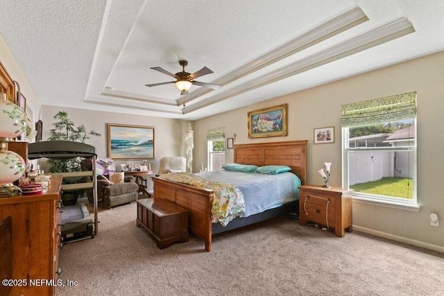 3912 Pipit Pt, Middleburg, FL 32068 - bedroom with a raised ceiling, multiple windows, carpet flooring, a textured ceiling, and a ceiling fan