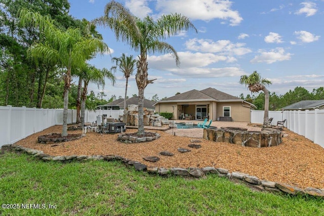 3912 Pipit Pt, Middleburg, FL 32068 - rear view of house with a fenced backyard and a patio area
