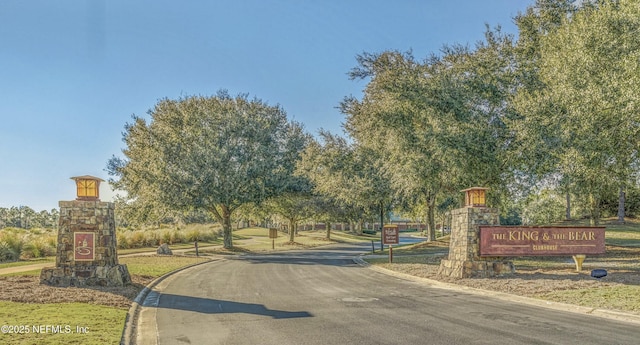 1439 Barrington Cir, Saint Augustine, FL 32092 - view of asphalt road featuring curbs and street lighting