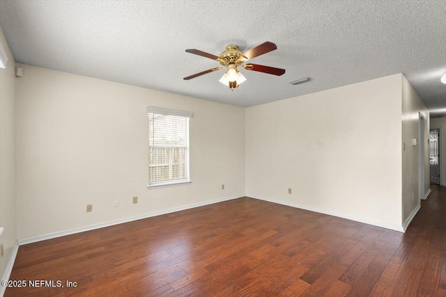1528 Jordan St, Atlantic Beach, FL 32233 - unfurnished room featuring wood finished floors, a ceiling fan, a textured ceiling, and baseboards