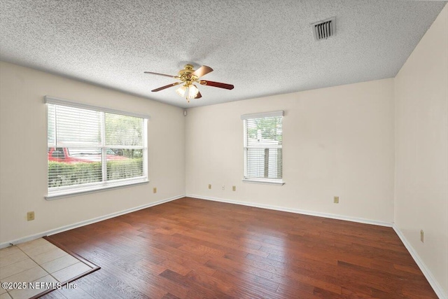 1528 Jordan St, Atlantic Beach, FL 32233 - unfurnished room featuring a ceiling fan, wood finished floors, a textured ceiling, and baseboards