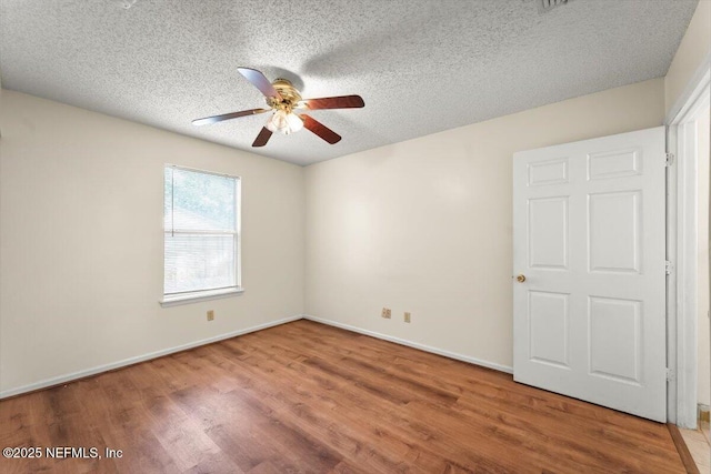 1528 Jordan St, Atlantic Beach, FL 32233 - spare room with ceiling fan, a textured ceiling, wood finished floors, and baseboards