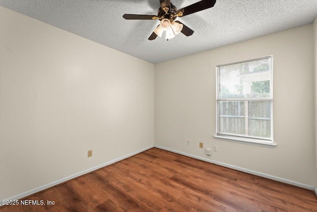 1528 Jordan St, Atlantic Beach, FL 32233 - unfurnished room with wood finished floors, baseboards, ceiling fan, and a textured ceiling
