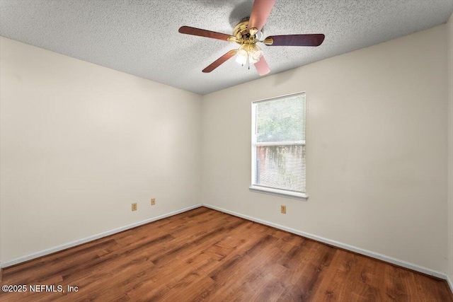 1528 Jordan St, Atlantic Beach, FL 32233 - spare room with wood finished floors, a ceiling fan, a textured ceiling, and baseboards