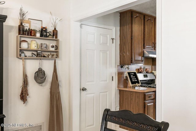 2041 Mill Creek Rd, Jacksonville, FL 32211 - kitchen with under cabinet range hood and light countertops