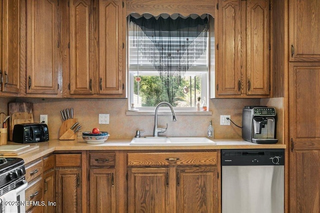 2041 Mill Creek Rd, Jacksonville, FL 32211 - kitchen featuring stainless steel dishwasher, a sink, light countertops, and brown cabinetry