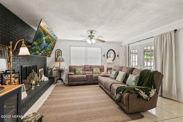 2041 Mill Creek Rd, Jacksonville, FL 32211 - living area with tile patterned flooring, ceiling fan, a fireplace, a textured ceiling, and french doors