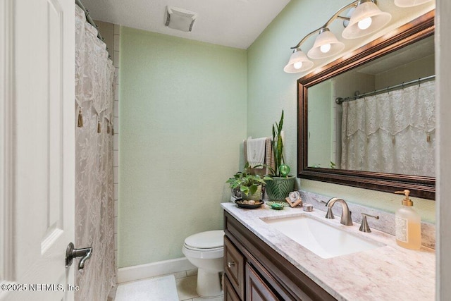 2041 Mill Creek Rd, Jacksonville, FL 32211 - full bath with vanity, toilet, tile patterned flooring, and baseboards