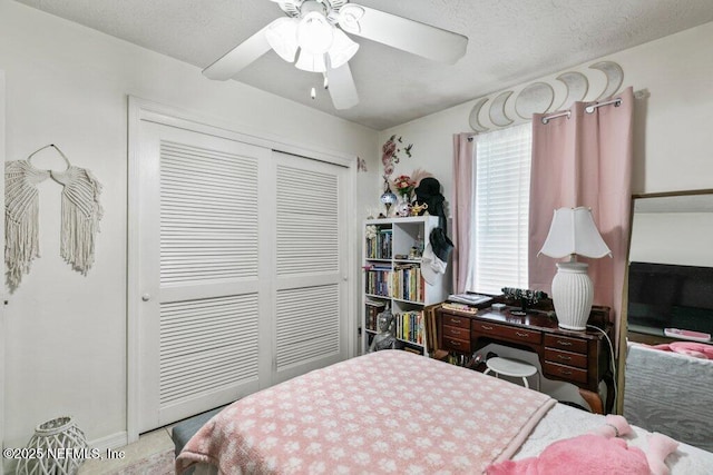 2041 Mill Creek Rd, Jacksonville, FL 32211 - bedroom with a closet, ceiling fan, and a textured ceiling