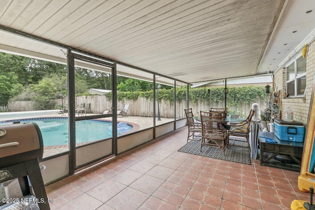2041 Mill Creek Rd, Jacksonville, FL 32211 - sunroom featuring tile patterned flooring and outdoor dining area