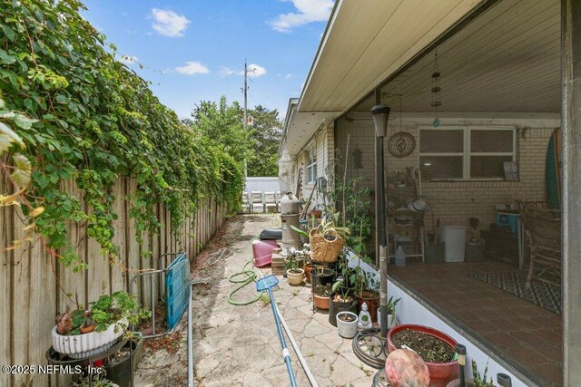2041 Mill Creek Rd, Jacksonville, FL 32211 - fenced backyard with a patio