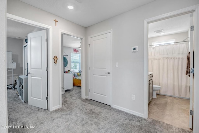 4604 Clapboard Crossing Way, Jacksonville, FL 32226 - corridor featuring light colored carpet and baseboards