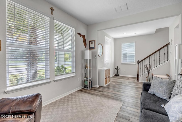 4604 Clapboard Crossing Way, Jacksonville, FL 32226 - entryway featuring wood finished floors, stairway, and baseboards