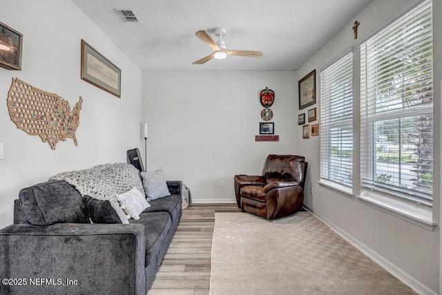 4604 Clapboard Crossing Way, Jacksonville, FL 32226 - living area featuring a ceiling fan, light wood finished floors, and baseboards