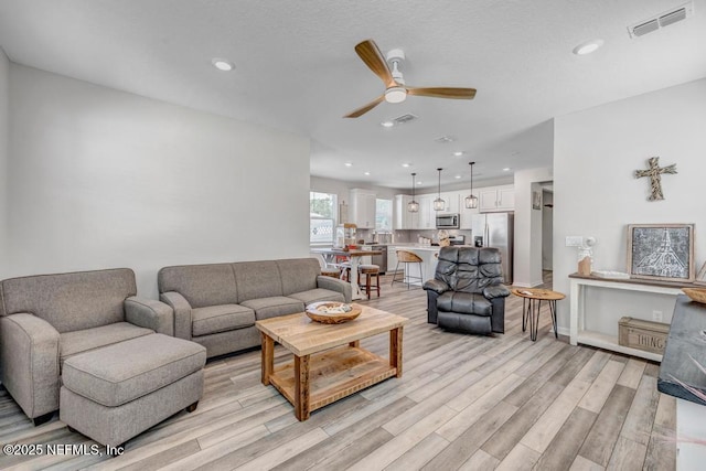 4604 Clapboard Crossing Way, Jacksonville, FL 32226 - living area featuring ceiling fan, light wood-type flooring, and recessed lighting