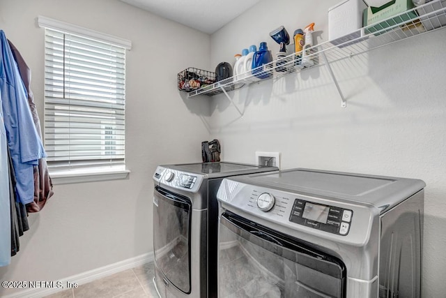 4604 Clapboard Crossing Way, Jacksonville, FL 32226 - washroom featuring washer and clothes dryer, tile patterned floors, and baseboards