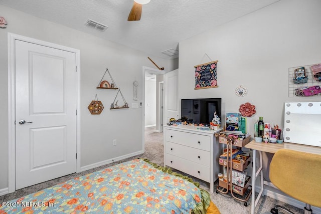 4604 Clapboard Crossing Way, Jacksonville, FL 32226 - carpeted bedroom featuring baseboards, a desk, a ceiling fan, and a textured ceiling