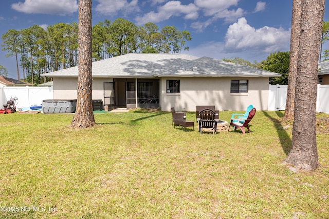 14 Ballard Ln, Palm Coast, FL 32137 - rear view of house featuring stucco siding, a fenced backyard, a sunroom, and a shingled roof