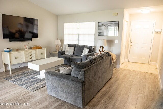 14 Ballard Ln, Palm Coast, FL 32137 - living area with light wood-style flooring and baseboards