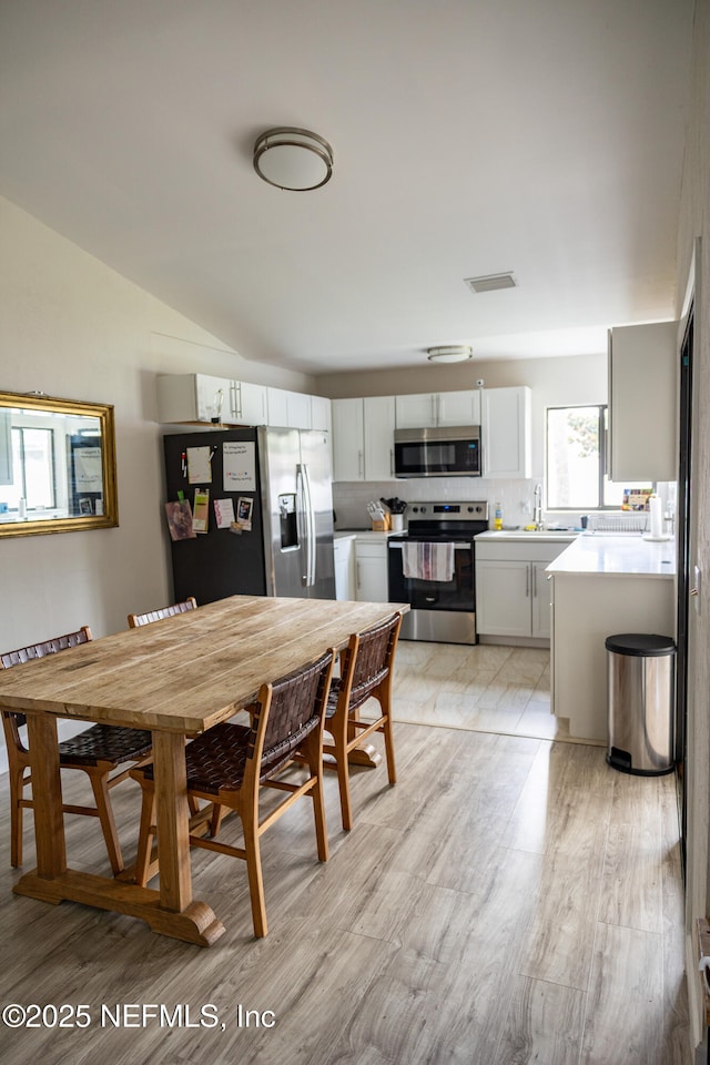 14 Ballard Ln, Palm Coast, FL 32137 - dining space with light wood-type flooring