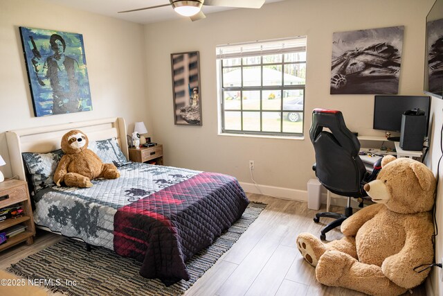 14 Ballard Ln, Palm Coast, FL 32137 - bedroom with wood finished floors, an office area, and a ceiling fan