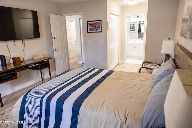 14 Ballard Ln, Palm Coast, FL 32137 - bedroom with wood finished floors and ensuite bathroom