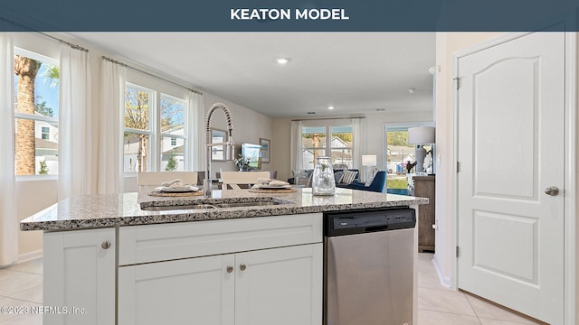 413 Seaport Breeze Rd, Saint Augustine, FL 32095 - kitchen featuring dishwasher, light tile patterned floors, a sink, light stone counters, and recessed lighting